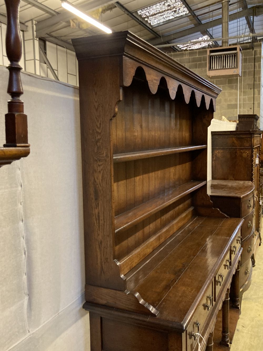 An 18th century style oak dresser, width 182cm depth 45cm height 198cm